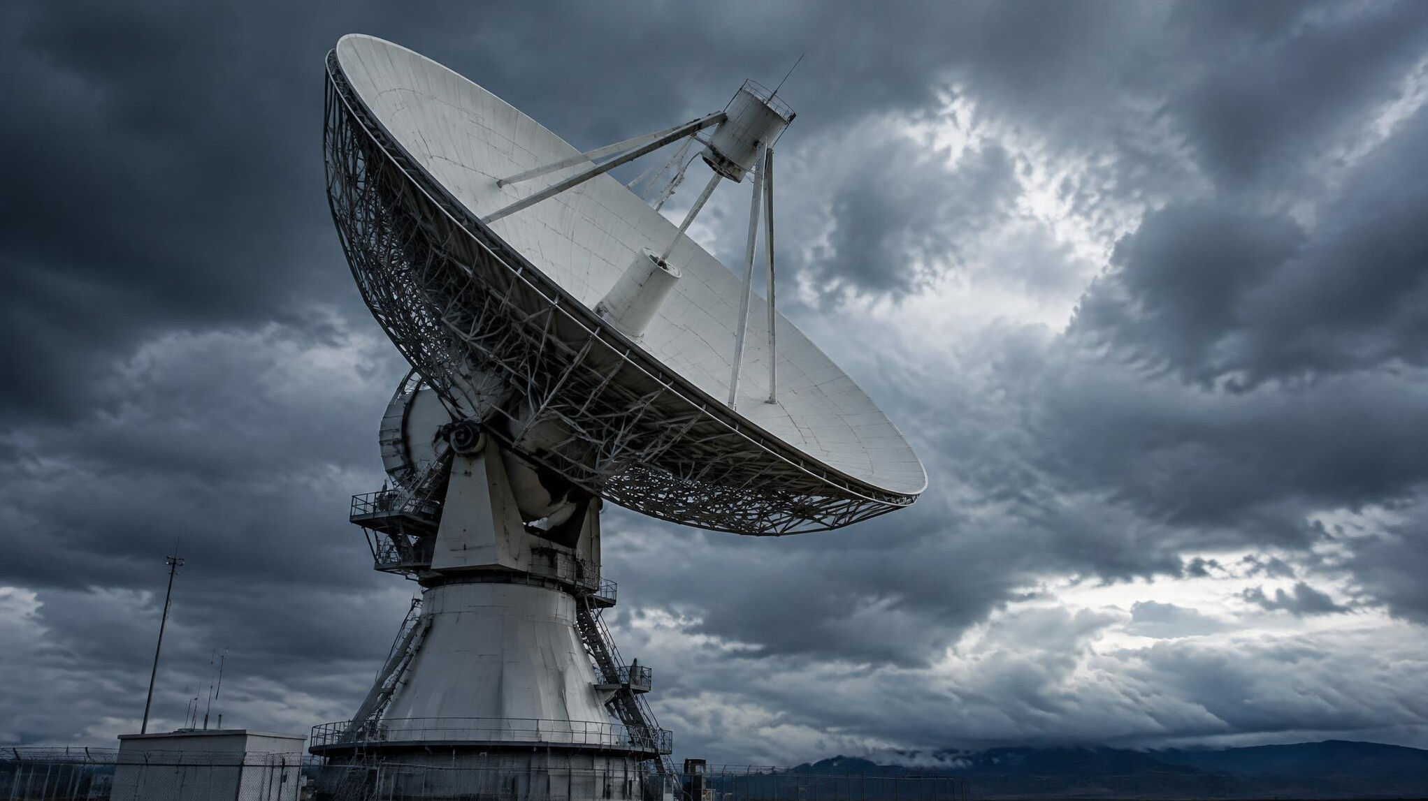Satellite dish against a cloudy sky