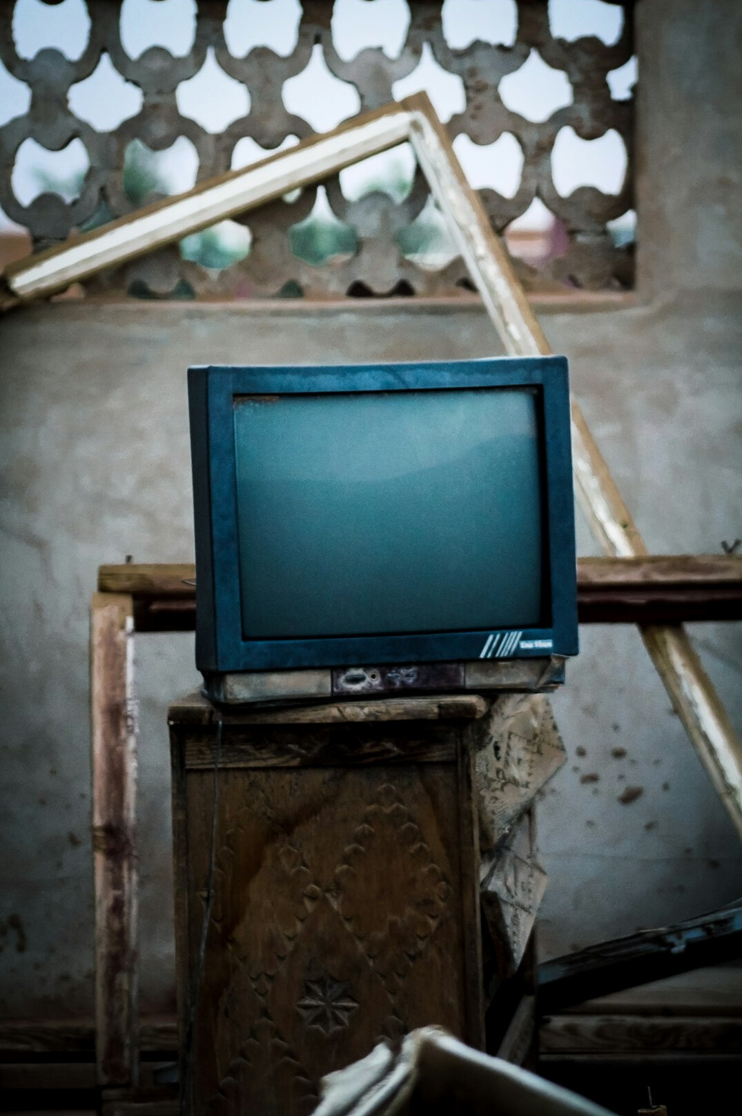 Old CRT monitor displaying abstract broadcast graphics